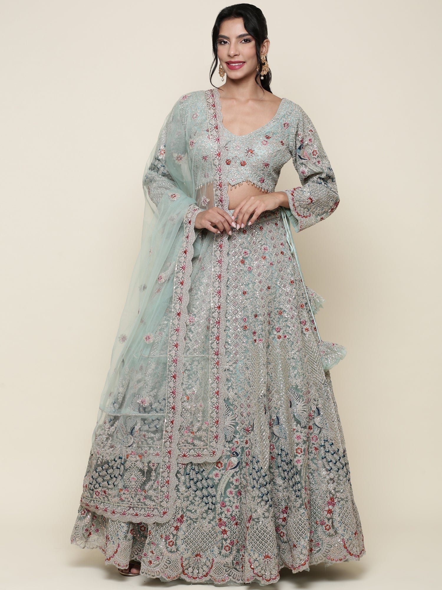 Sea green net heavy embroidered Three piece ghagra set